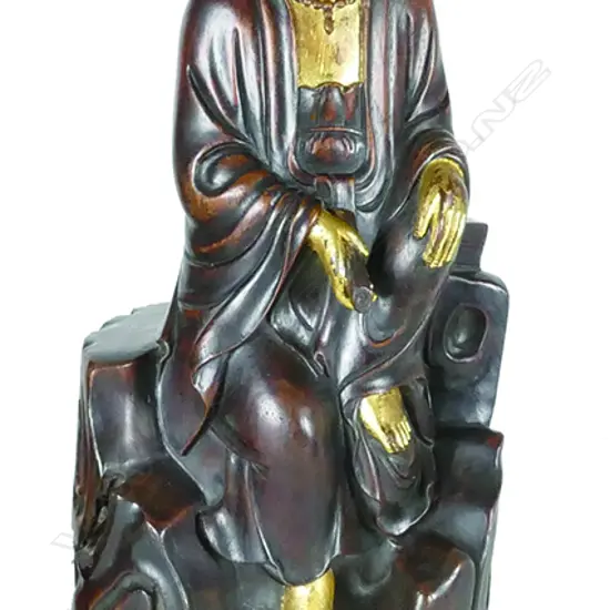 An old Chinese carved hardwood figure of Kuanyin