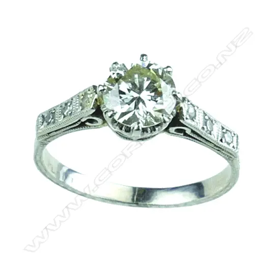 An estate platinum and solitaire diamond ring