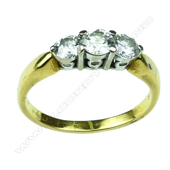 An 18ct gold and three stone diamond ring