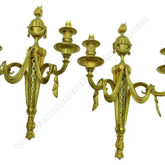 A matching set of four gilt brass twin branch wall lights of French style
