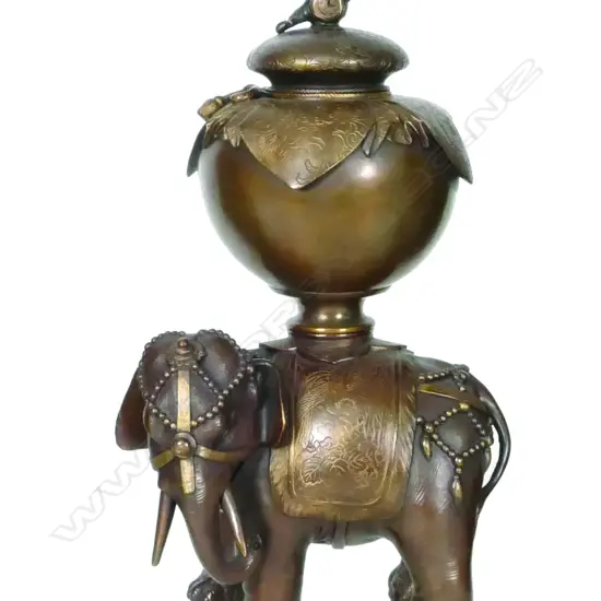 An Oriental bronze vase on elephant stand