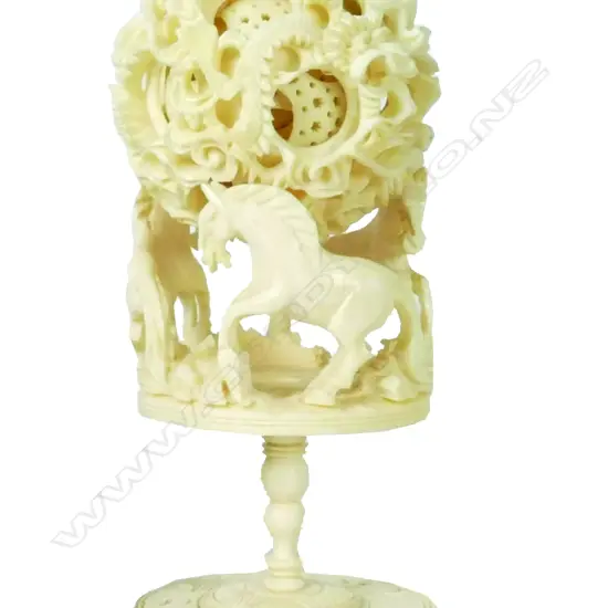 A Chinese carved ivory puzzle ball on stand
