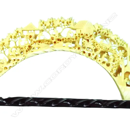 A large ornately carved ivory hippopotamus tusk