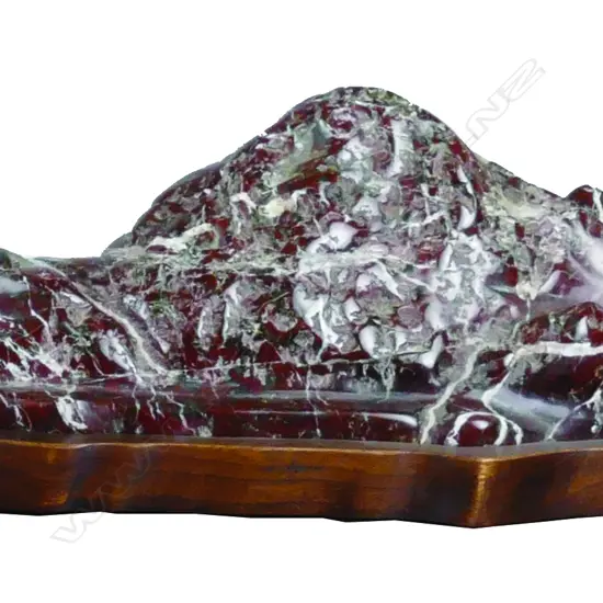 A scholar's rock on wooden plinth stand