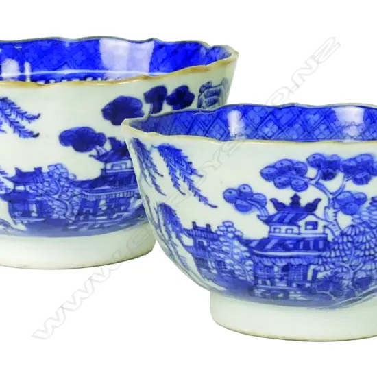 A pair of 19thC Chinese blue and white willow pattern tea bowls