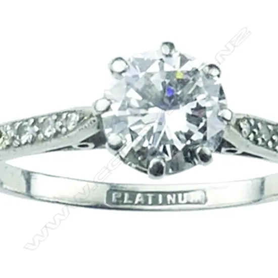 An estate platinum and diamond solitaire ring