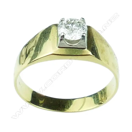 An 18ct. gold and diamond set gent's ring