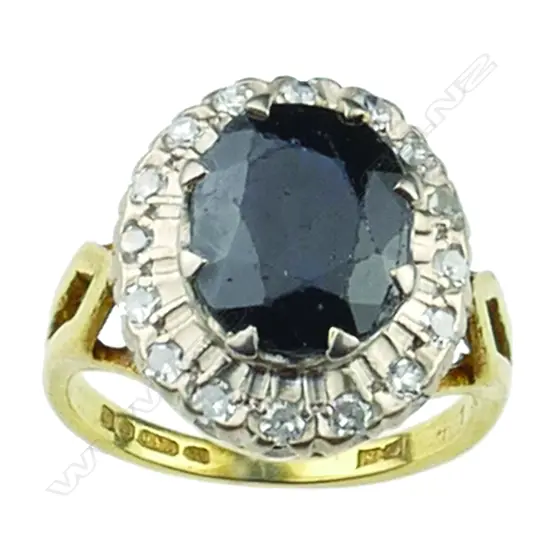 An 18ct gold sapphire and diamond cluster ring