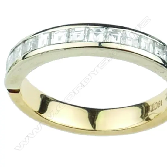A lady's modern 18ct. white and yellow gold and diamond eternity ring