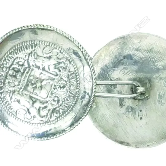 A pair of c.1900 Dutch silver pillow ends