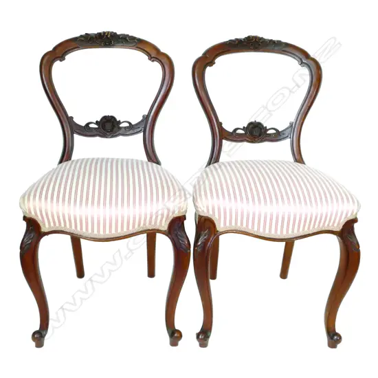 A set of six Victorian walnut framed balloon back dining chairs