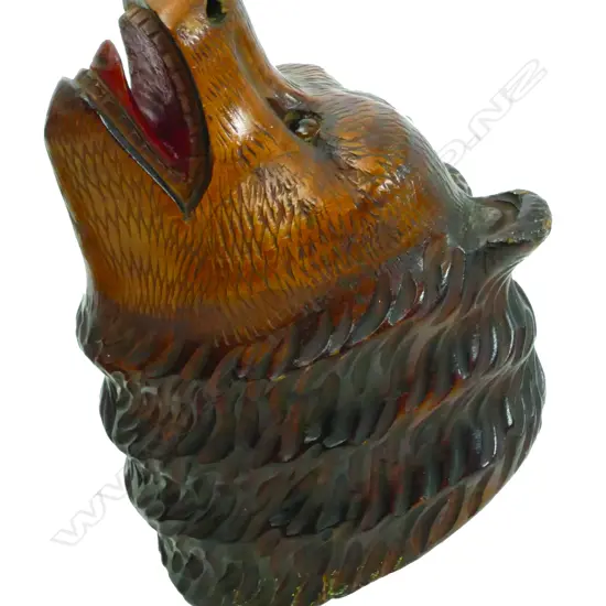 An early 20thC Black Forest carved bear head match box holder