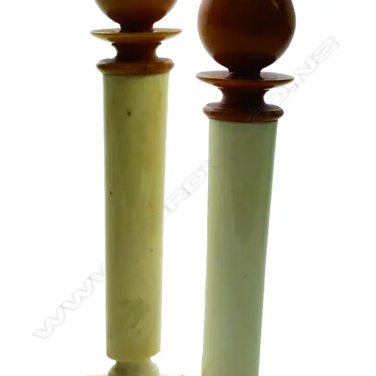 A pair of early 20thC ivory and Bakelite column candlesticks