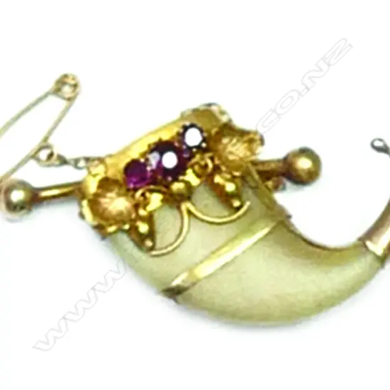 A c.1900 gilded gold mounted tiger's claw brooch