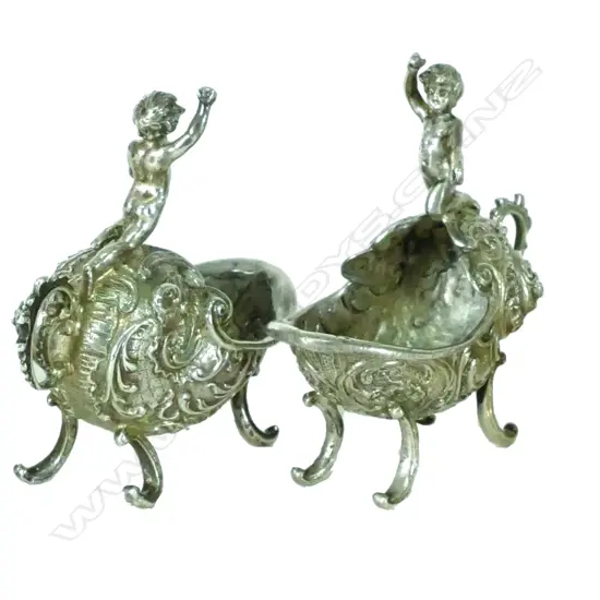 A pair of late 19thC European rococo cast silver salts