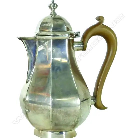 A silver coffee or chocolate pot