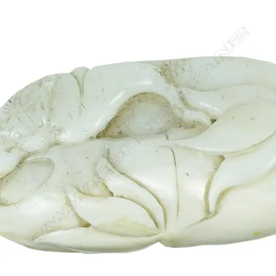 A large Chinese white jade fingering piece
