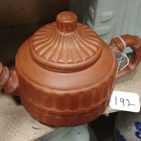 A Chinese Yixing small redware clay teapot