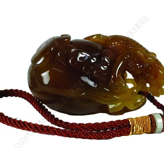 A Chinese carved round jade handling piece