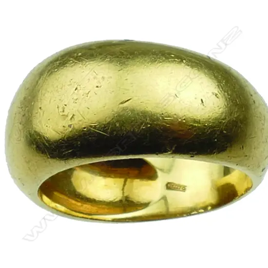 An 18ct. yellow gold wide domed band ring