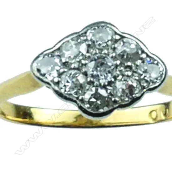 An Art Deco 18ct. and diamond cluster ring