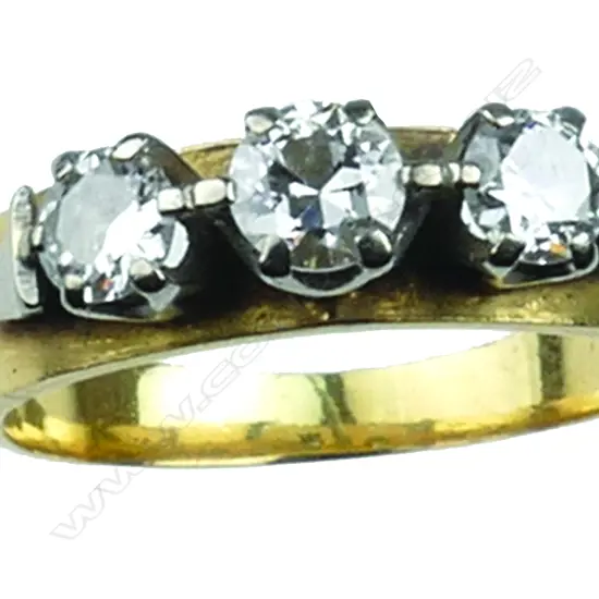 A vintage 18ct. yellow gold and three stone diamond ring