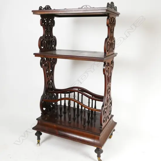 A Victorian rosewood whatnot/canterbury