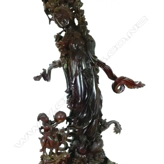 A large rosewood carved figure of Kwan Yin