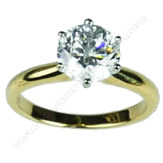 An 18ct. yellow gold and diamond solitaire ring