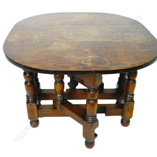 A small low vintage oak gateleg occasional table