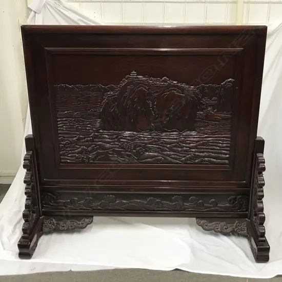 A carved Oriental rosewood standing screen
