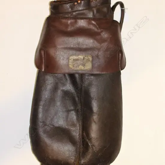 An old leather golf bag with six hickory shafted clubs