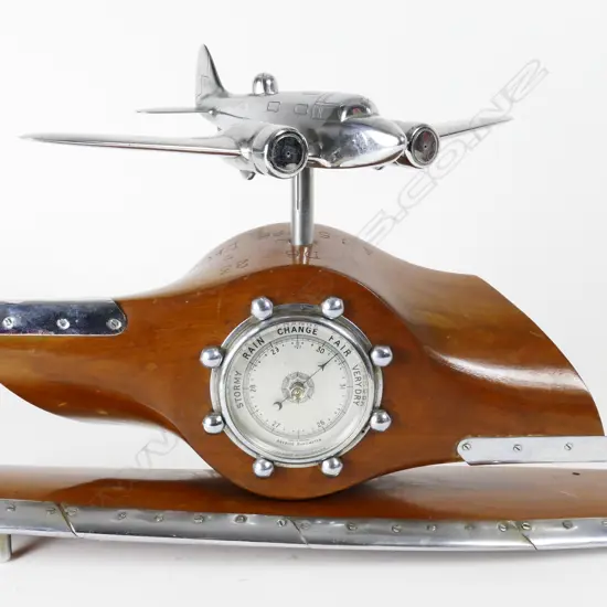 A chromed brass model of an Airspeed Oxford training bomber with dorsal turret