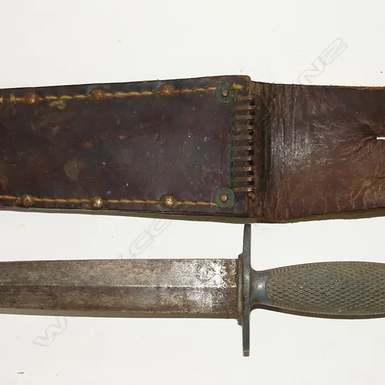 A vintage Fairbairn Sykes style Commando stiletto knife in scabbard