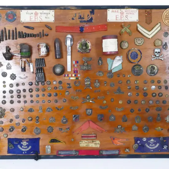 An impressive vintage military collection on display board