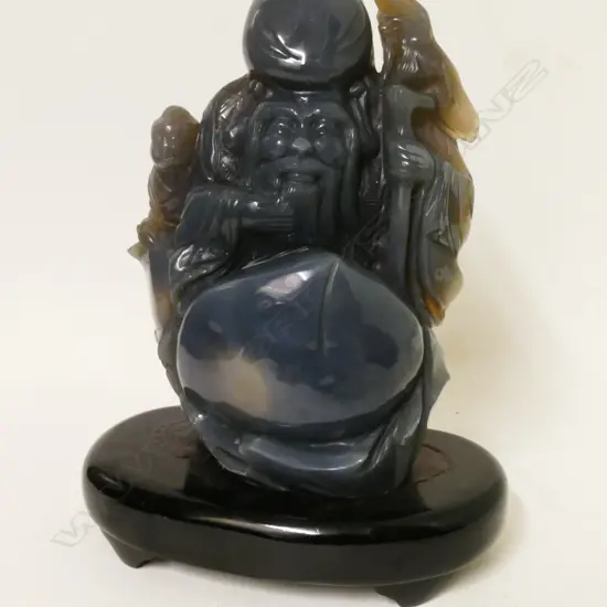 A Chinese grey rock crystal carved figure of Shao Xing