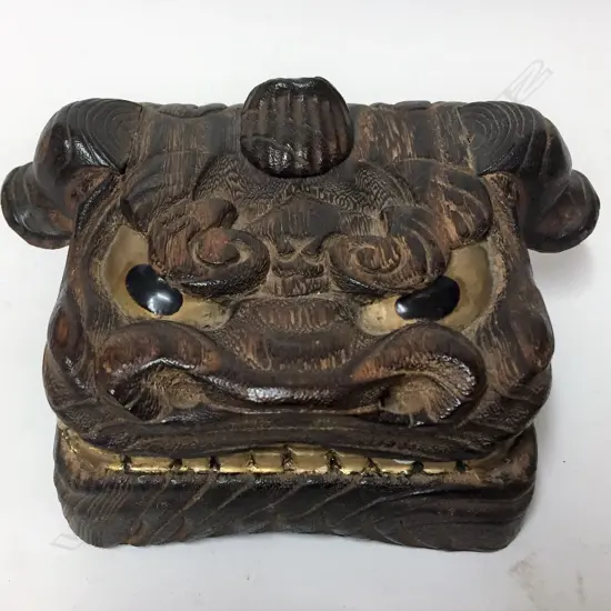 A Chinese carved bamboo square box as the head of a mythical lion