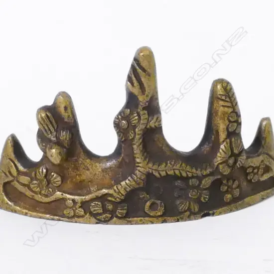 A Chinese bronze brush rest