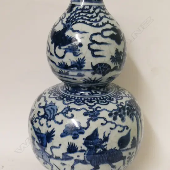 A Chinese porcelain double gourd vase in the manner of the Ming period