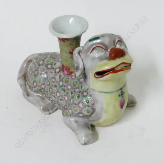 A Chinese porcelain temple lion dog incense holder