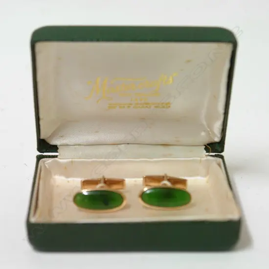 A pair of 1960s 'Master Crafts' 9ct. rose gold and greenstone cufflinks