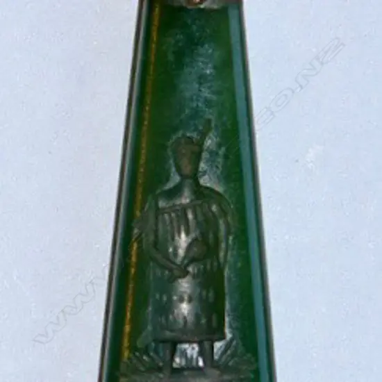 A Colonial 9ct. gold and greenstone pendant