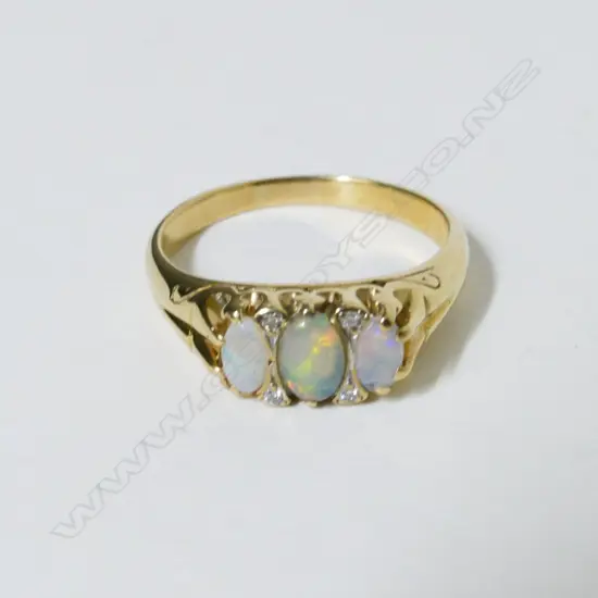 A 9ct. gold opal and diamond ring