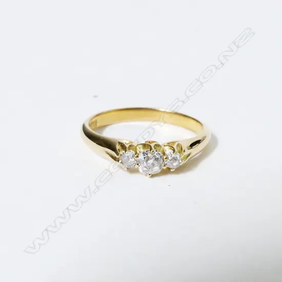 An 18ct. gold and three stone diamond ring