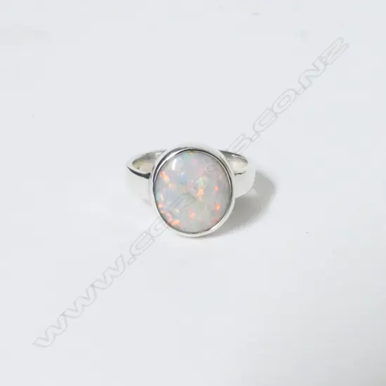 A silver and opal ring