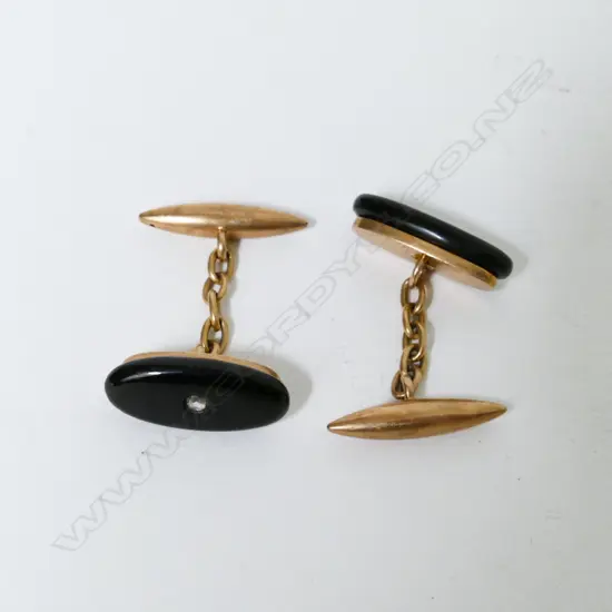 A pair of 15ct. rose gold and onyx cuff links