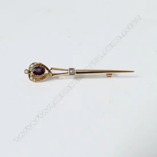 A 9ct. gold amethyst and seed pearl set sword brooch