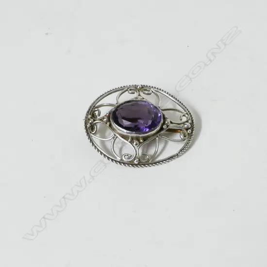 A silver and amethyst Arts & Crafts brooch