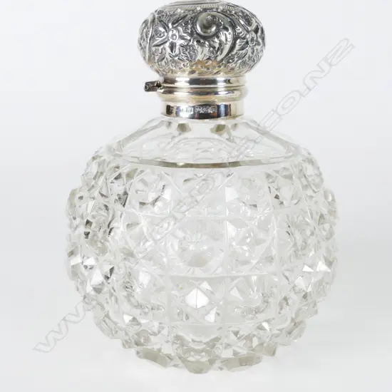 A large Edwardian cut crystal and silver scent bottle