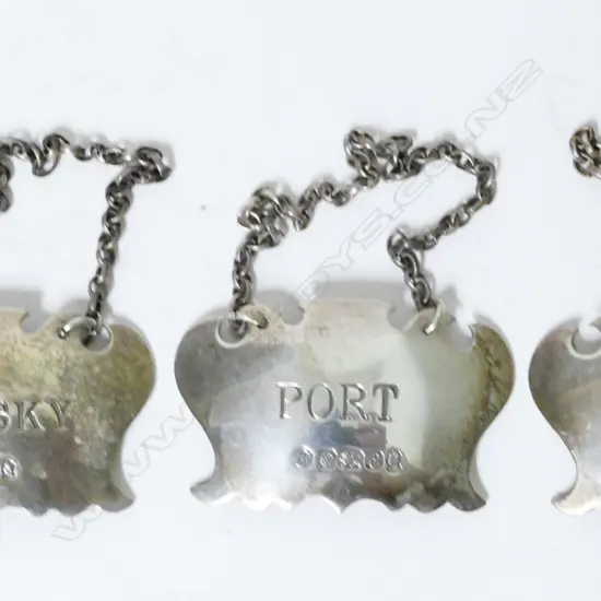 Three silver decanter tickets